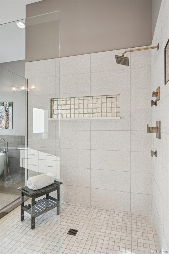 445 Forest St, Denver, CO 80220 - bathroom with a stall shower, tile walls, and tile patterned flooring