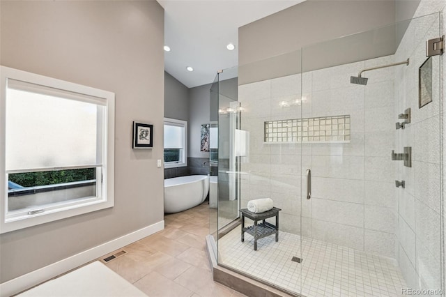 445 Forest St, Denver, CO 80220 - full bath featuring a freestanding tub, a shower stall, lofted ceiling, recessed lighting, and tile patterned flooring
