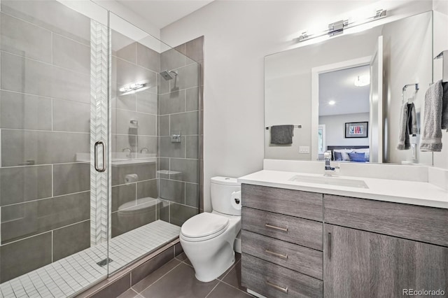 445 Forest St, Denver, CO 80220 - bathroom featuring vanity, a stall shower, tile patterned floors, and connected bathroom