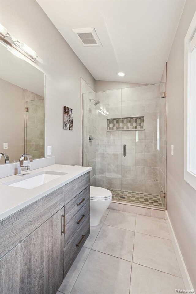445 Forest St, Denver, CO 80220 - full bathroom with vanity, a stall shower, and tile patterned floors