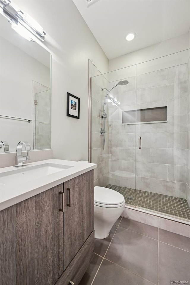 445 Forest St, Denver, CO 80220 - full bath featuring vanity, a shower stall, and tile patterned floors