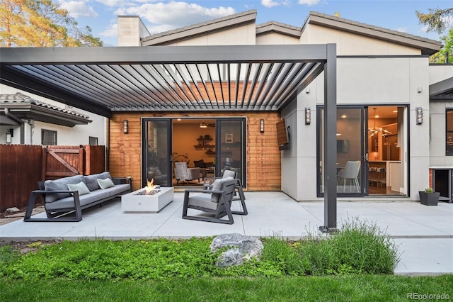 445 Forest St, Denver, CO 80220 - rear view of house featuring an outdoor living space with a fire pit, a patio area, stucco siding, a gate, and a chimney
