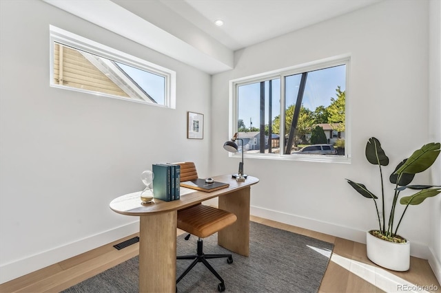 home office featuring recessed lighting, visible vents, baseboards, and wood finished floors