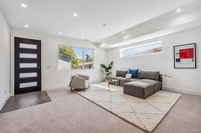 living area with recessed lighting, carpet flooring, and baseboards