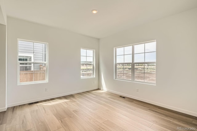 15228 Detroit St, Thornton, CO 80602 - spare room featuring light wood-type flooring and baseboards