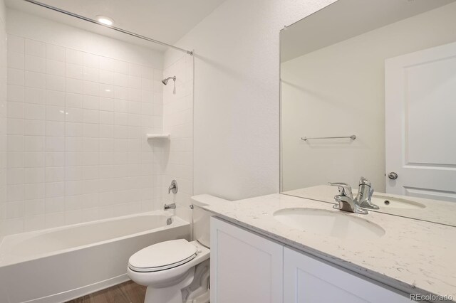 15228 Detroit St, Thornton, CO 80602 - bathroom with vanity, wood finished floors, and shower / tub combination