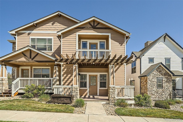 5624 Killdeer St, Brighton, CO 80601 - view of front of house with a porch and stone siding