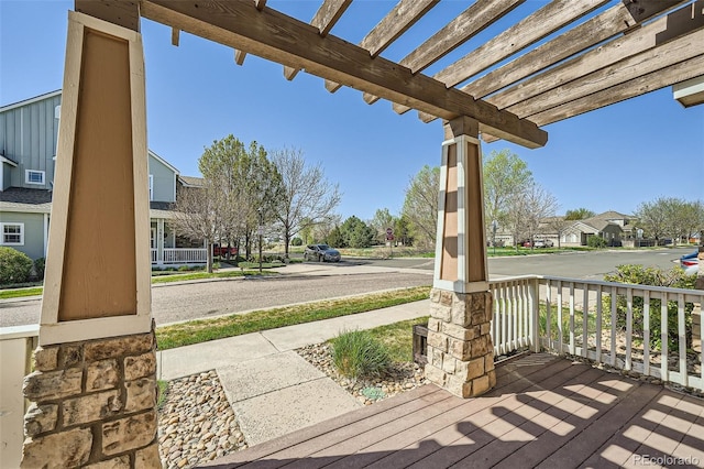5624 Killdeer St, Brighton, CO 80601 - wooden porch featuring a pergola and a residential view
