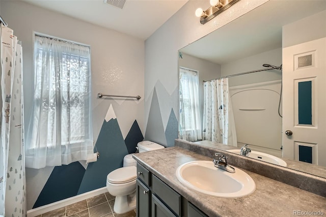 5624 Killdeer St, Brighton, CO 80601 - full bath with vanity, toilet, baseboards, and curtained shower
