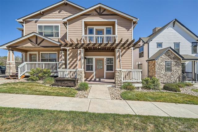 5624 Killdeer St, Brighton, CO 80601 - multi unit property with a porch, stone siding, and a pergola