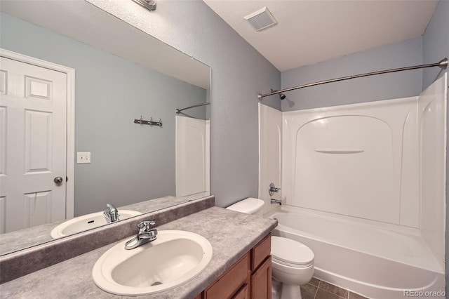 5624 Killdeer St, Brighton, CO 80601 - bathroom featuring vanity, toilet, bathtub / shower combination, and tile patterned floors