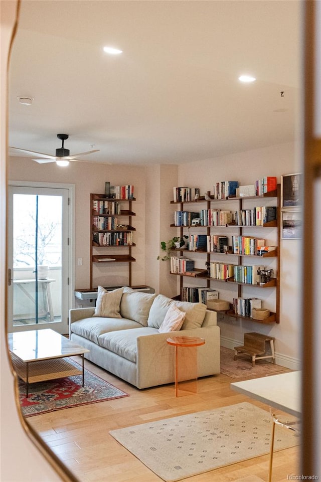 living room featuring recessed lighting, wood finished floors, and a ceiling fan