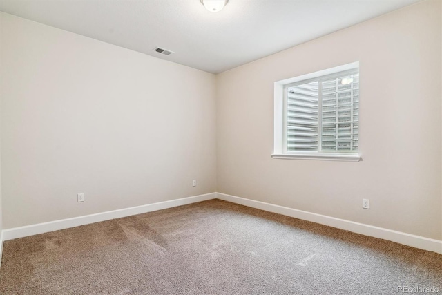 spare room with carpet flooring