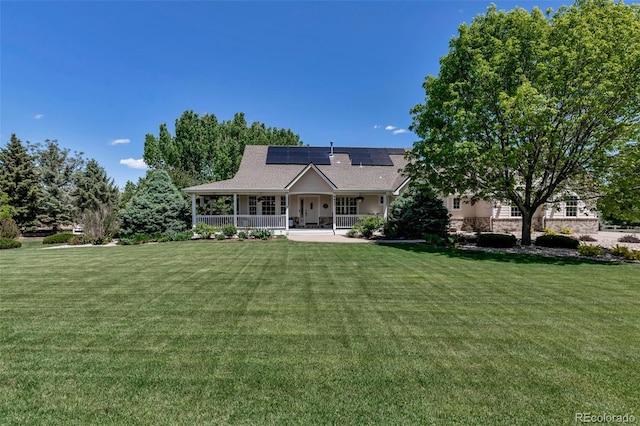 6633 E 166th Pl, Brighton, CO 80602 - view of front of property with a porch, a front lawn, roof mounted solar panels, and stone siding