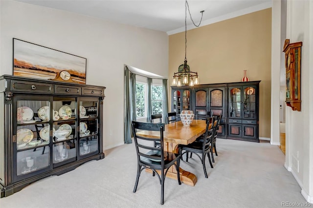 6633 E 166th Pl, Brighton, CO 80602 - dining area with a chandelier, baseboards, light colored carpet, and a towering ceiling