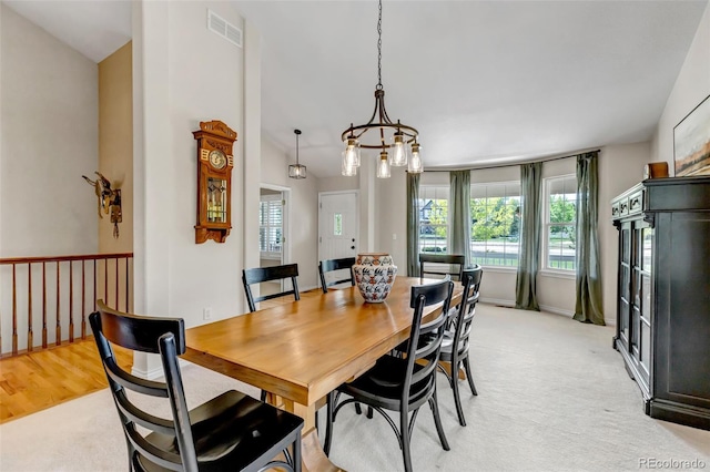 6633 E 166th Pl, Brighton, CO 80602 - dining space featuring plenty of natural light, baseboards, light carpet, and a chandelier
