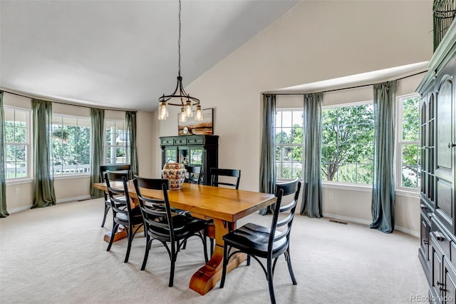 6633 E 166th Pl, Brighton, CO 80602 - dining room with high vaulted ceiling, light carpet, and baseboards