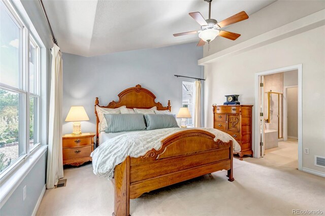 6633 E 166th Pl, Brighton, CO 80602 - bedroom featuring light carpet, lofted ceiling, baseboards, ensuite bath, and ceiling fan