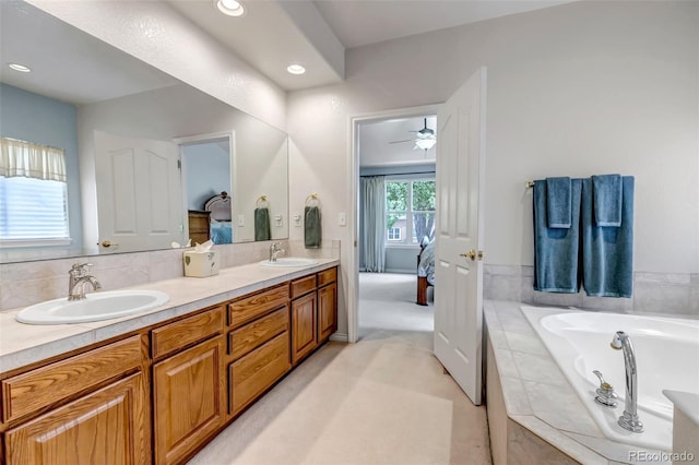 6633 E 166th Pl, Brighton, CO 80602 - full bathroom with connected bathroom, double vanity, ceiling fan, a bath, and recessed lighting
