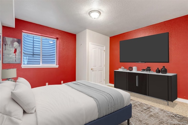 6633 E 166th Pl, Brighton, CO 80602 - bedroom featuring a textured ceiling, baseboards, a textured wall, and carpet flooring