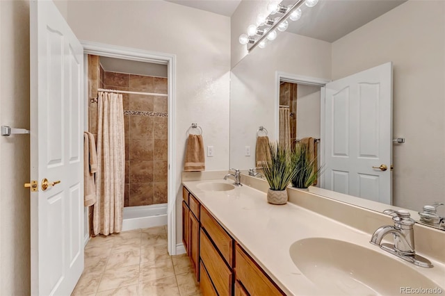 6633 E 166th Pl, Brighton, CO 80602 - full bathroom featuring double vanity and marble look tile flooring