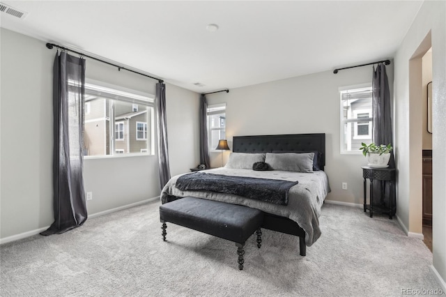 bedroom with visible vents, baseboards, and carpet floors