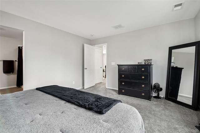 bedroom featuring baseboards, visible vents, and carpet floors