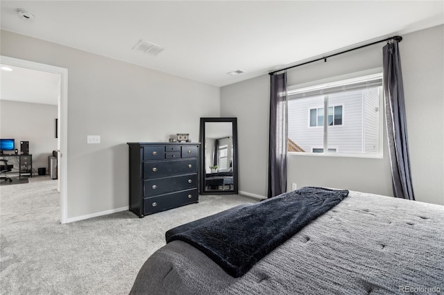 bedroom with carpet flooring, baseboards, and visible vents