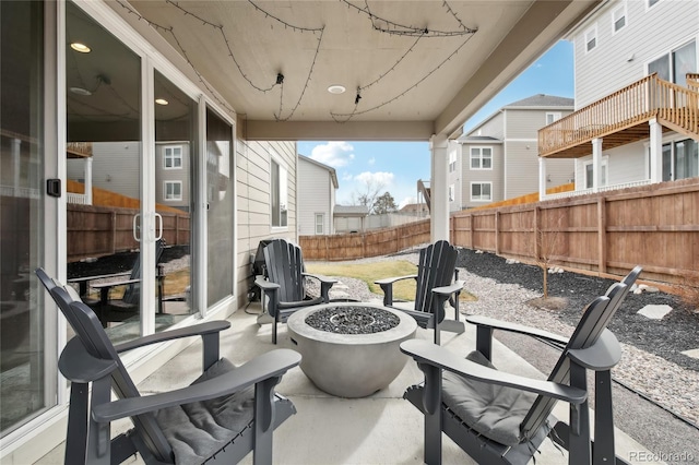 view of patio featuring a fire pit and a fenced backyard