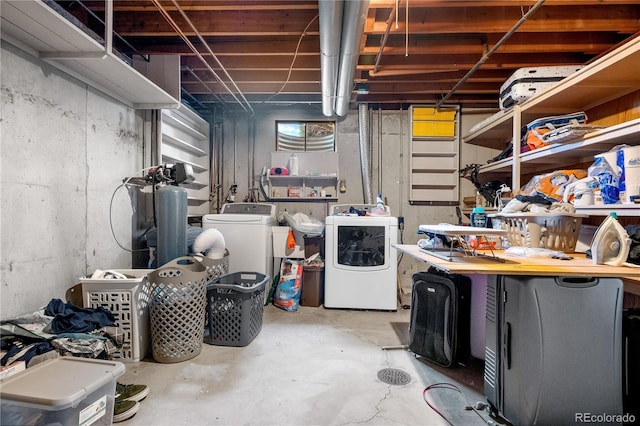 basement featuring washing machine and clothes dryer