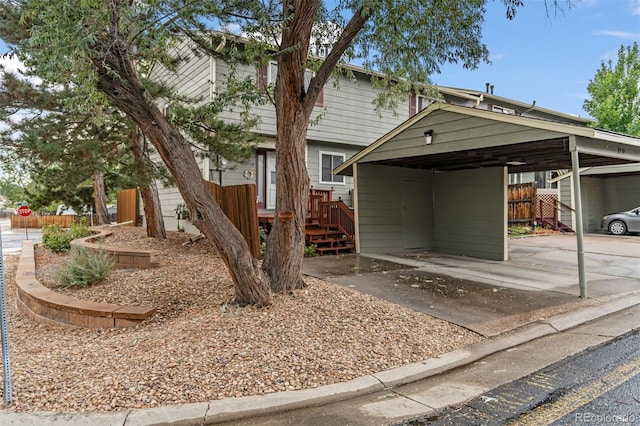 view of front of property with a carport