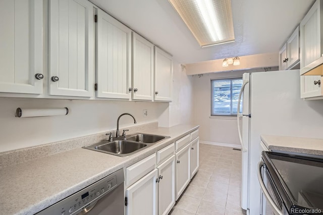 kitchen with white cabinetry, white refrigerator, dishwasher, and sink