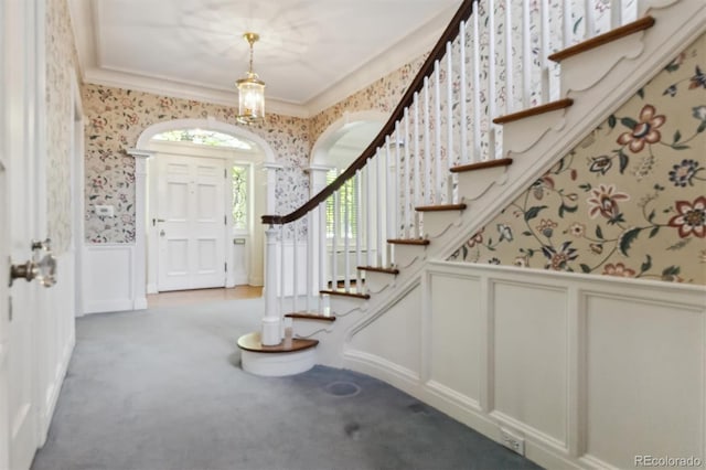 2222 E 7th Avenue Parkway, Denver, CO 80206 - carpeted foyer with a decorative wall, wallpapered walls, wainscoting, and stairs