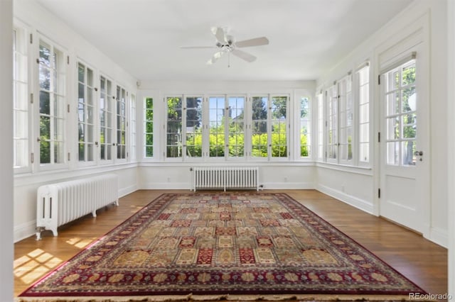 2222 E 7th Avenue Parkway, Denver, CO 80206 - unfurnished sunroom featuring radiator, french doors, wood finished floors, and baseboards