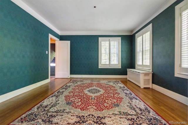 2222 E 7th Avenue Parkway, Denver, CO 80206 - empty room with crown molding, wood finished floors, and baseboards