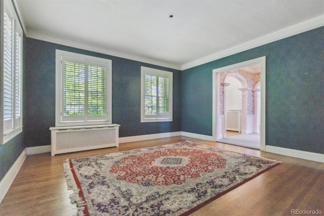 2222 E 7th Avenue Parkway, Denver, CO 80206 - spare room with ornamental molding, wood finished floors, radiator heating unit, and baseboards