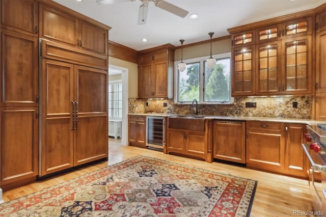 2222 E 7th Avenue Parkway, Denver, CO 80206 - kitchen with wine cooler, light wood-style flooring, tasteful backsplash, a ceiling fan, and light stone countertops