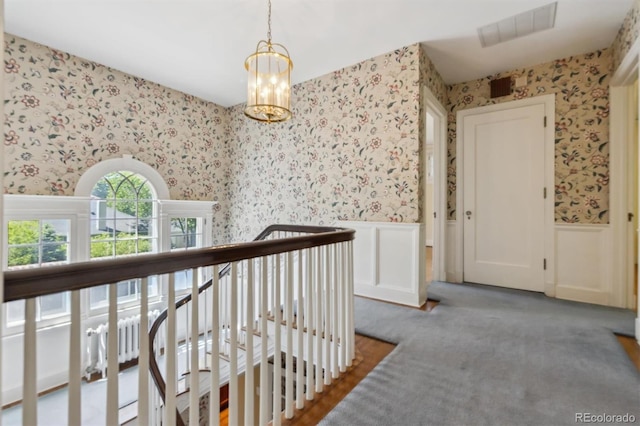 2222 E 7th Avenue Parkway, Denver, CO 80206 - hallway with wallpapered walls, wainscoting, carpet, an upstairs landing, and a decorative wall
