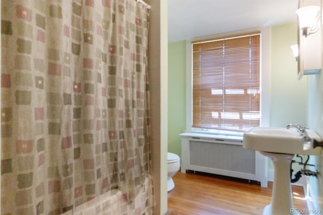 2222 E 7th Avenue Parkway, Denver, CO 80206 - full bath with toilet, wood finished floors, and a shower with curtain