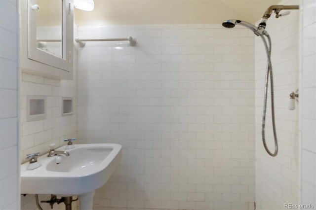 2222 E 7th Avenue Parkway, Denver, CO 80206 - full bathroom featuring a tile shower, tile walls, and a sink