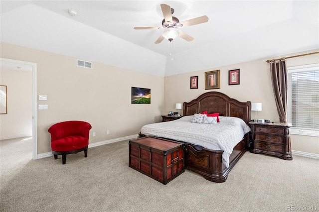 bedroom with a ceiling fan, visible vents, baseboards, vaulted ceiling, and light colored carpet