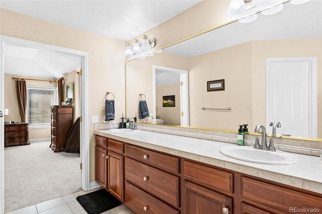 full bathroom with ensuite bath, double vanity, and a sink