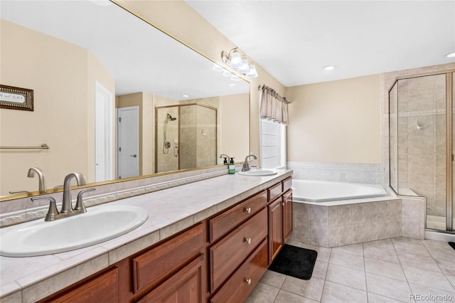 full bathroom featuring tile patterned floors, a shower stall, a bath, and a sink