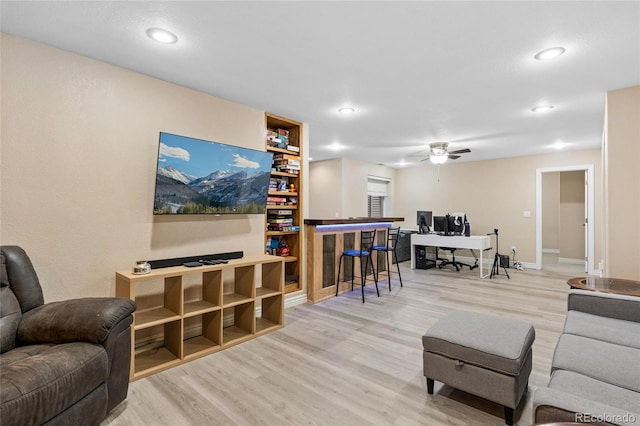 living area featuring ceiling fan, wood finished floors, and recessed lighting