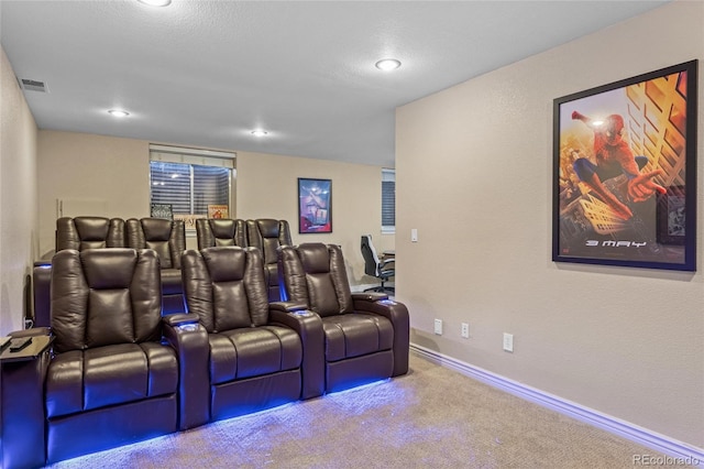 home theater featuring visible vents, carpet floors, and baseboards