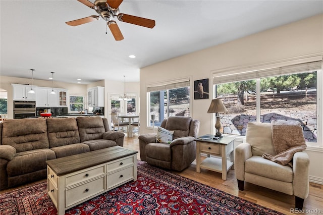 living room featuring recessed lighting, wood finished floors, and ceiling fan