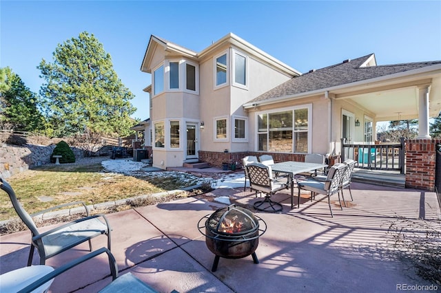 view of patio featuring entry steps and an outdoor fire pit