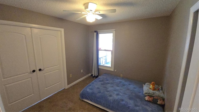 4543 Cathay St, Denver, CO 80249 - bedroom with carpet, a textured ceiling, and a ceiling fan