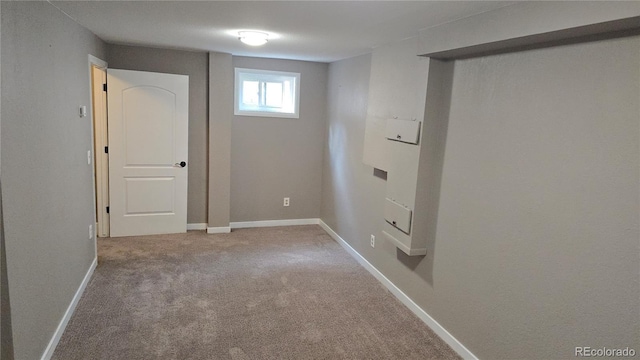 4543 Cathay St, Denver, CO 80249 - below grade area featuring carpet flooring and baseboards