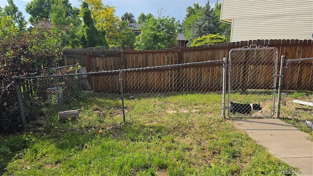 4543 Cathay St, Denver, CO 80249 - fenced backyard featuring a gate
